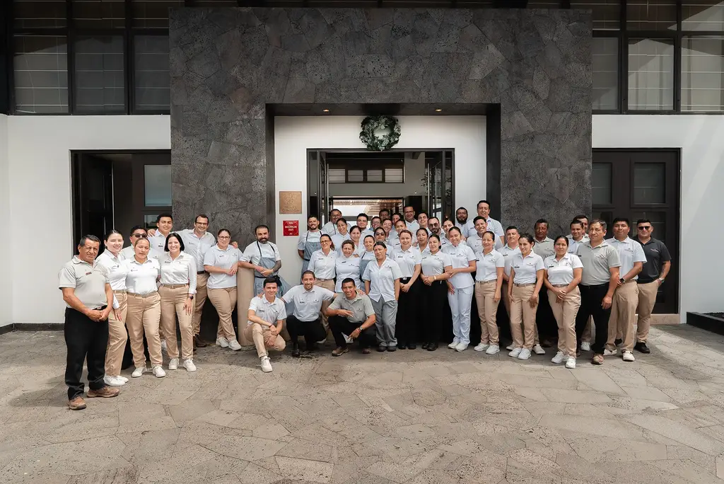 Pikaia Lodge team outside the lodge entrance
