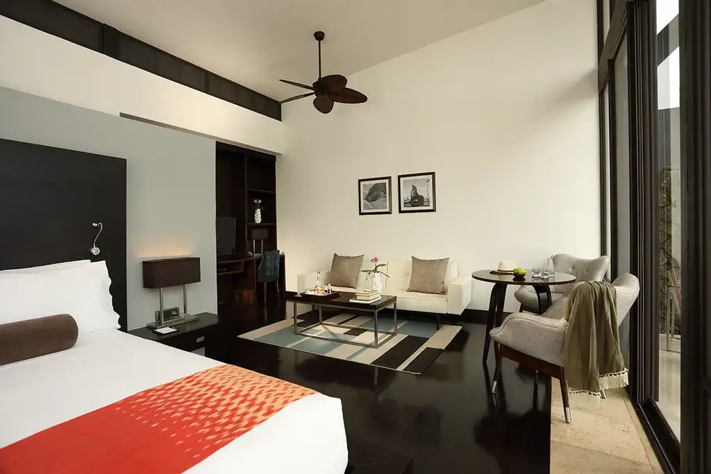 Garden Suite bedroom with king bed and seating area