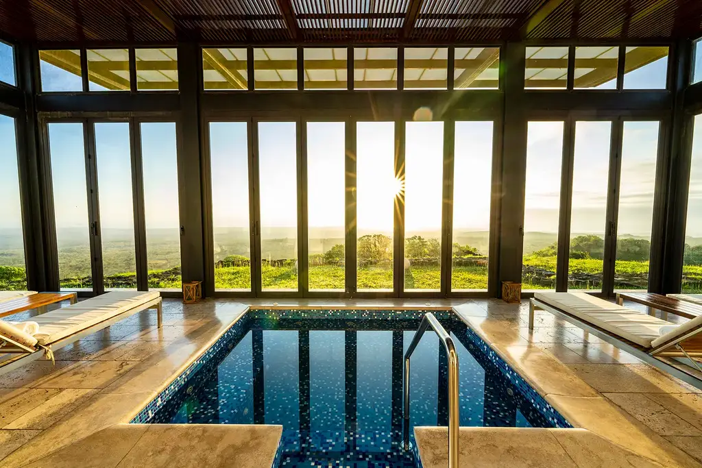 SUMAQ Spa lounge and plunge pool at sunset